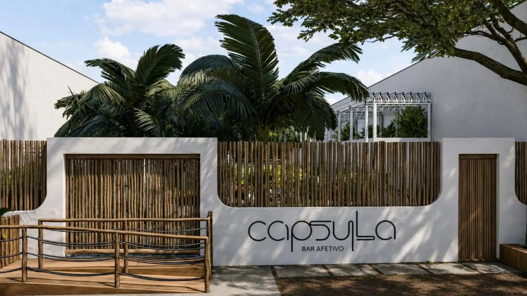 Fachada do Cápsula Bar em taipa e madeira, iluminada à noite